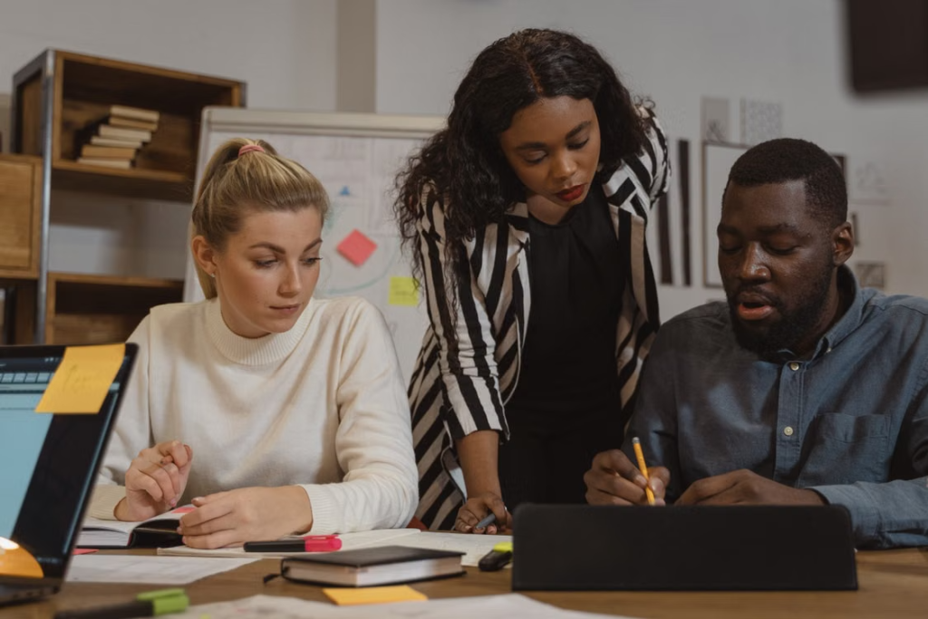 Multicultural office environment where diverse team members collaborate on a project